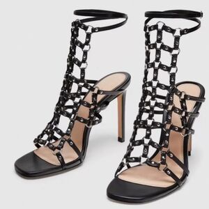 Zara black leather caged heeled sandals.